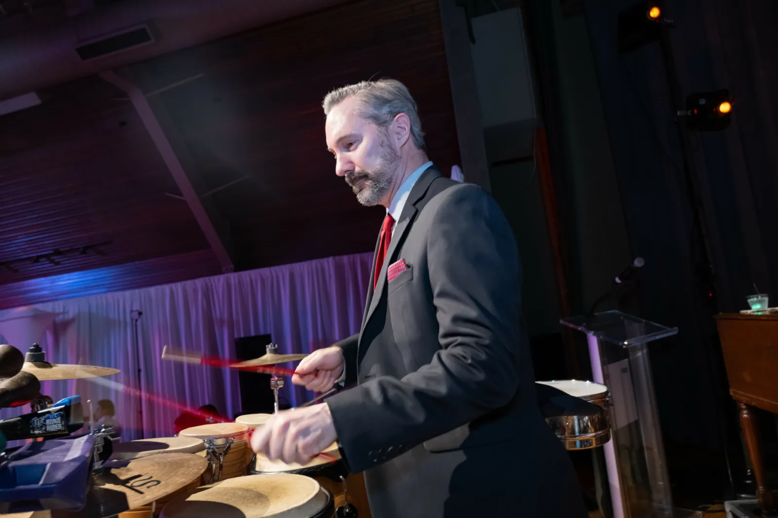 Man drumming at Riley Red event