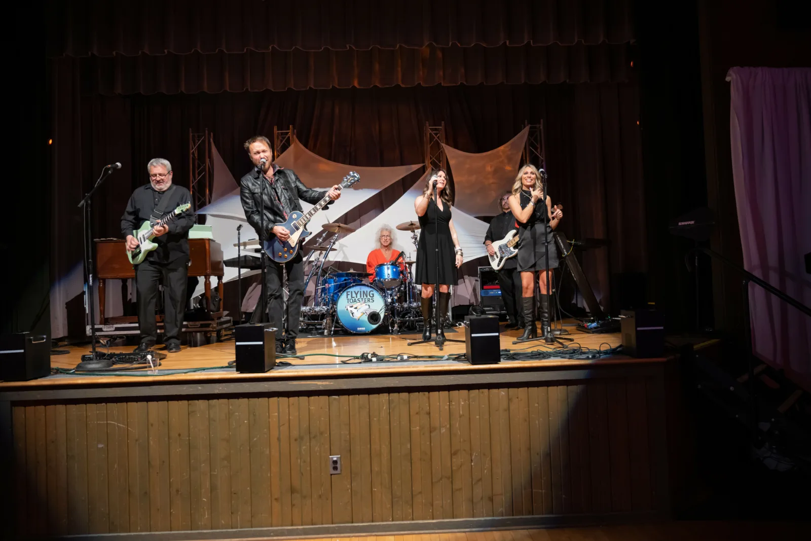 Band on stage at Riley Red event