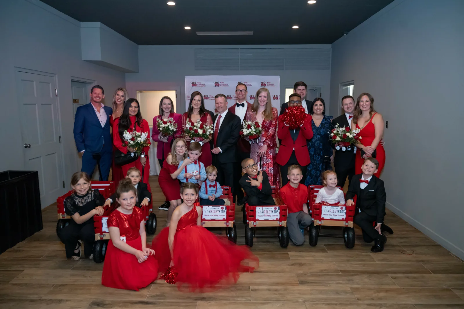Riley kids and families posing for photos at Riley Red event