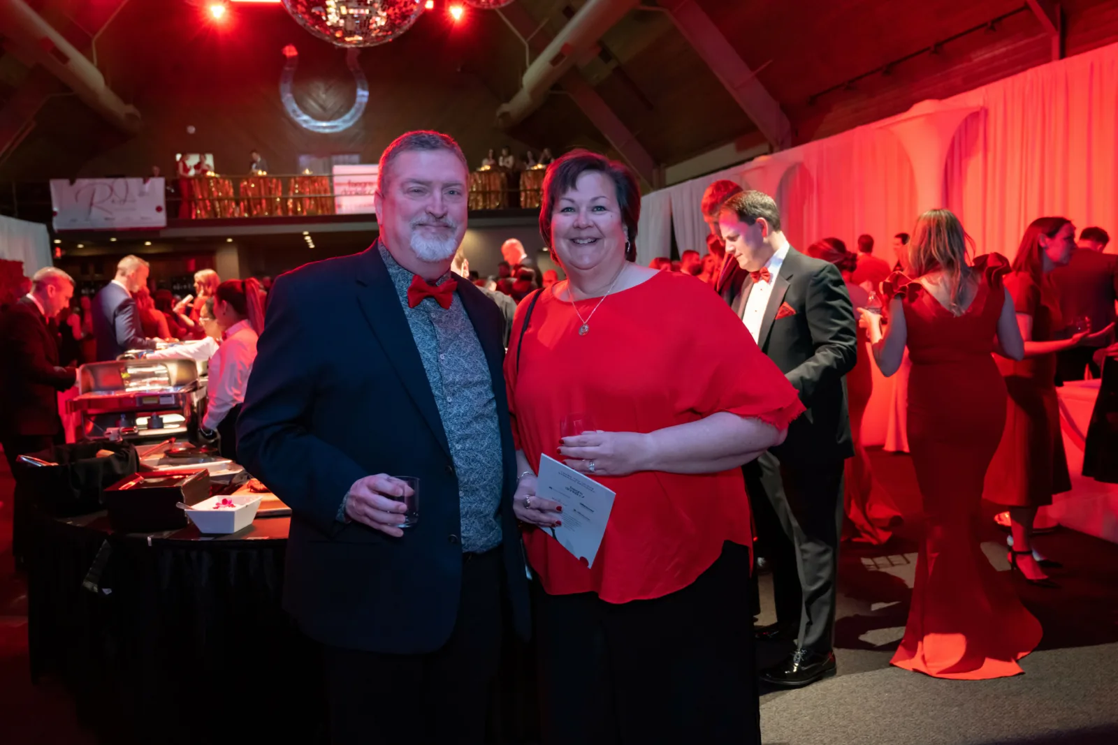 Two Riley supporters posing for photo at Riley Red event