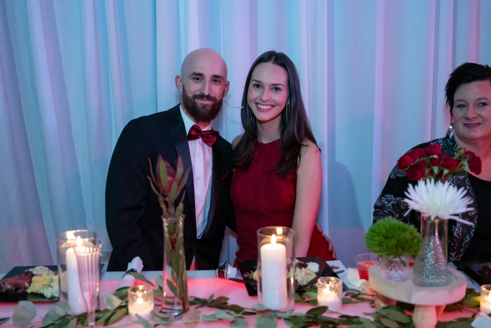 Couple posing for photo at Riley Red event