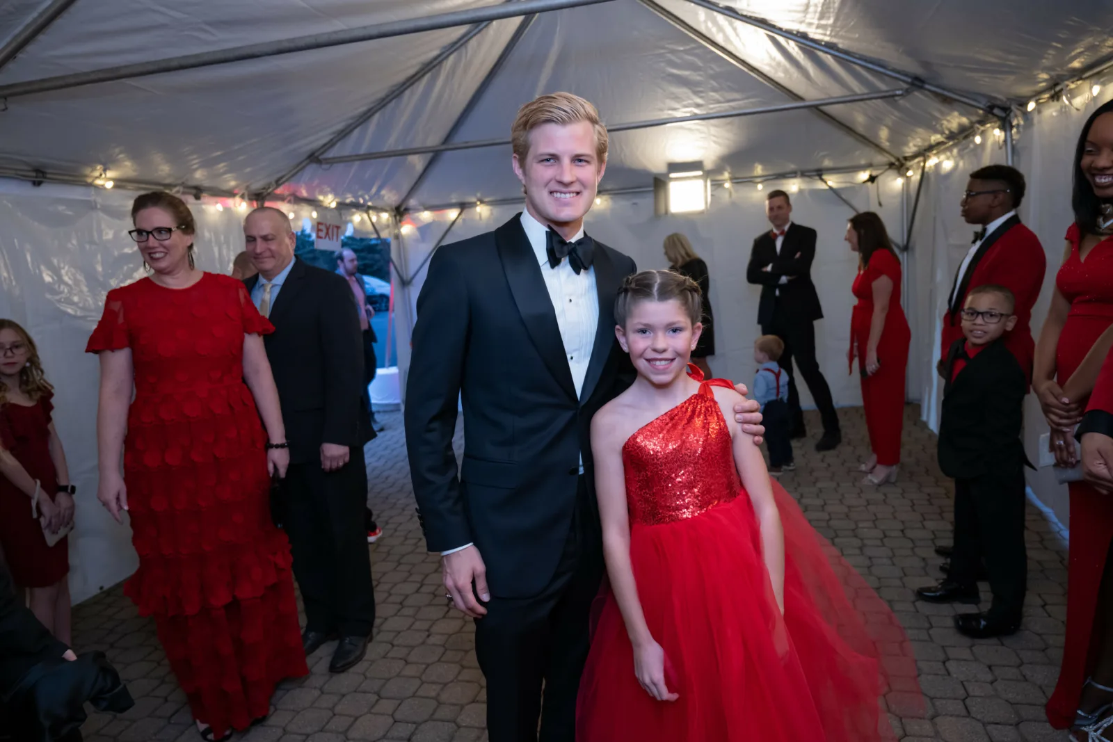Marcus Ericsson with Riley kid at Riley Red event