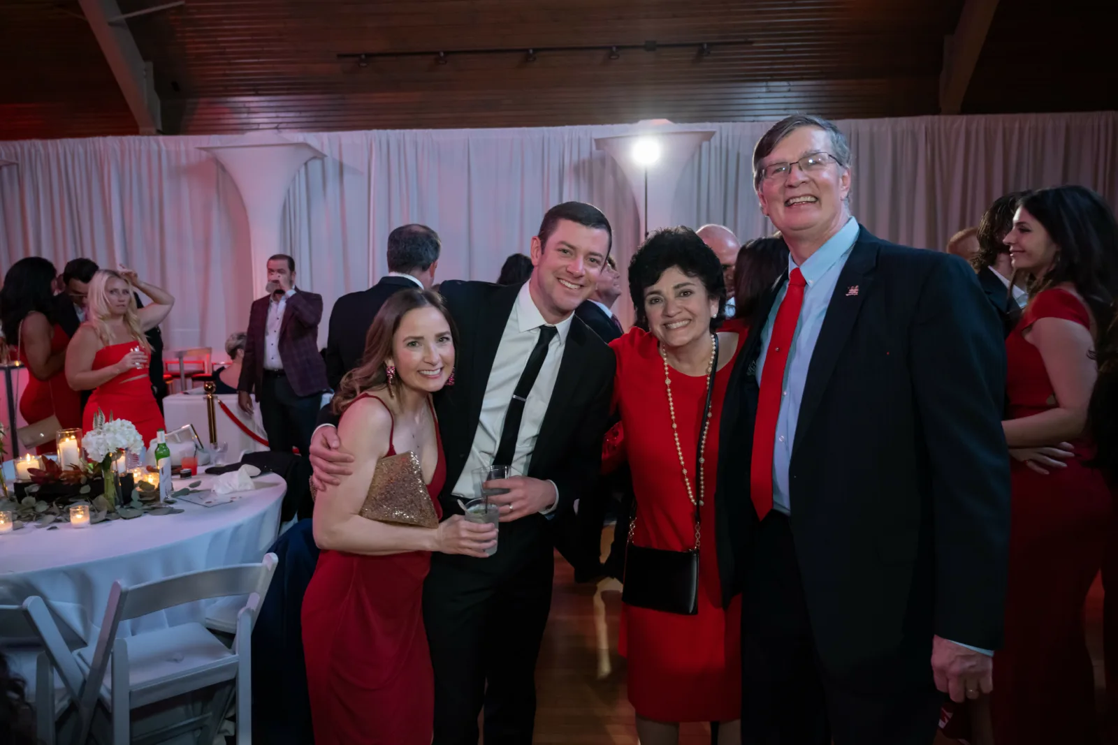 Riley CEO with group at Riley Red event