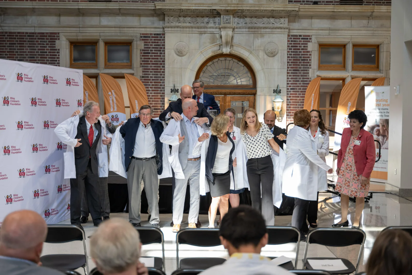 Walther Cancer Foundation event white coat presentation on stage