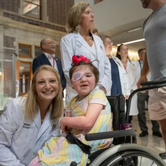 Riley kid and Riley doctor pose for photo