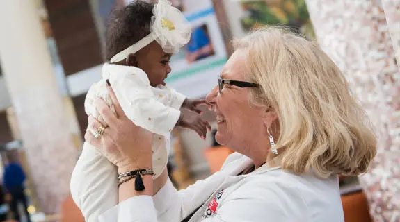 Riley kid Carlie Evans with Riley Cardiology doctor