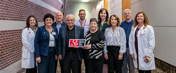 Group photo with Indiana's First Certified Duchenne Care Center plaque