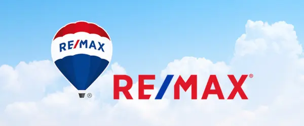 REMAX  logo with hot air balloon with clouds in the background