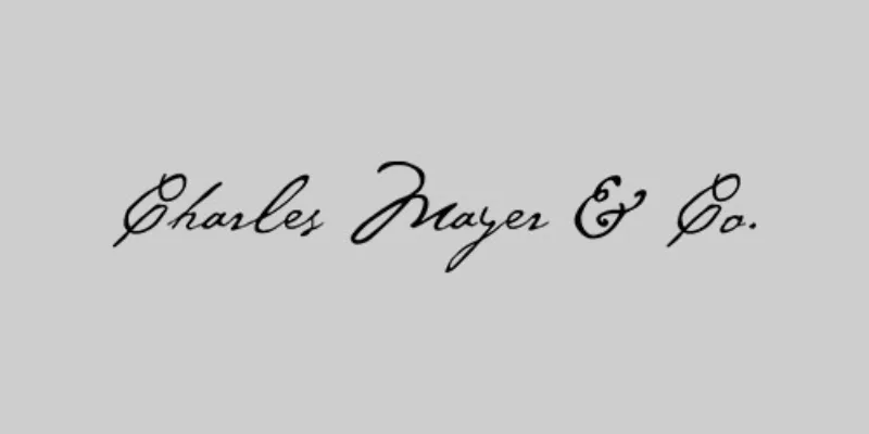 White rectangle with black letters that read Charles Mayer and Co.